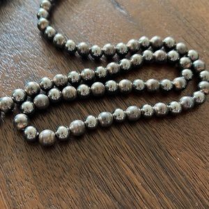 Gun metal gray polished beaded necklace.